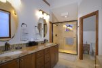 Large en-suite master bathroom with dual vanities, walk-n shower, and soaking tub